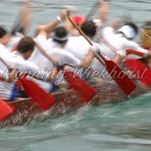 Group of people in a boat shown in artistic blur of motion - Henning Wiekhorst