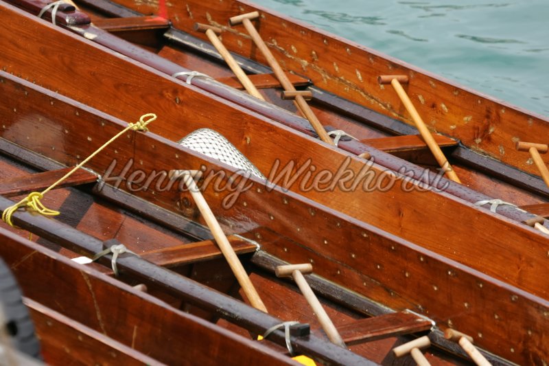 Wooden dragon boats and paddles - Henning Wiekhorst